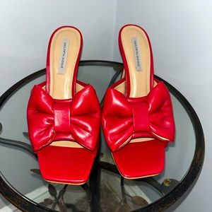 Puffed bow leather stiletto heels